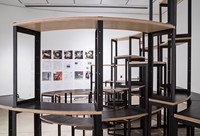 Adrian Blackwell's sixth configuration of furniture is centered in the Blackwood Gallery space with the broadsheets located along the back wall and in neat stacks on the floor.